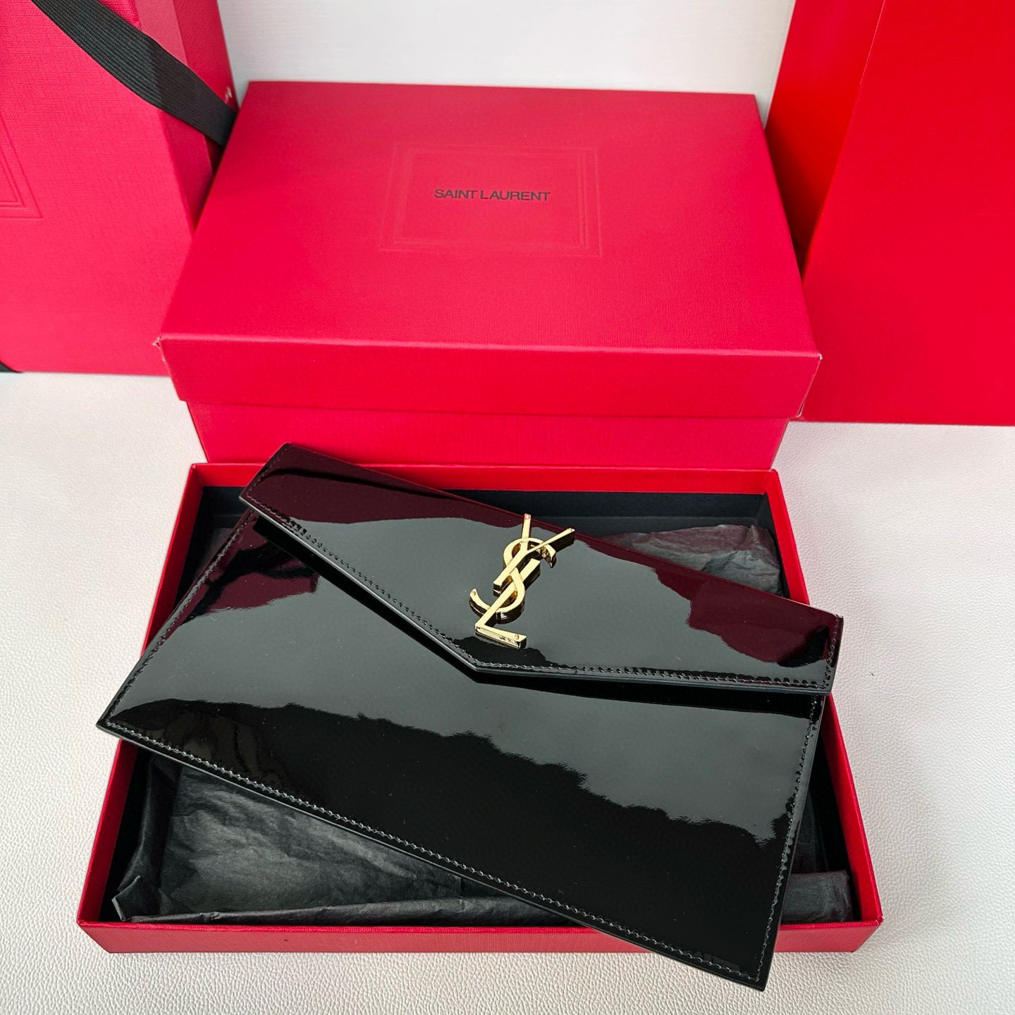 Yves Saint Laurent Uptown Pouch In Patent Leather