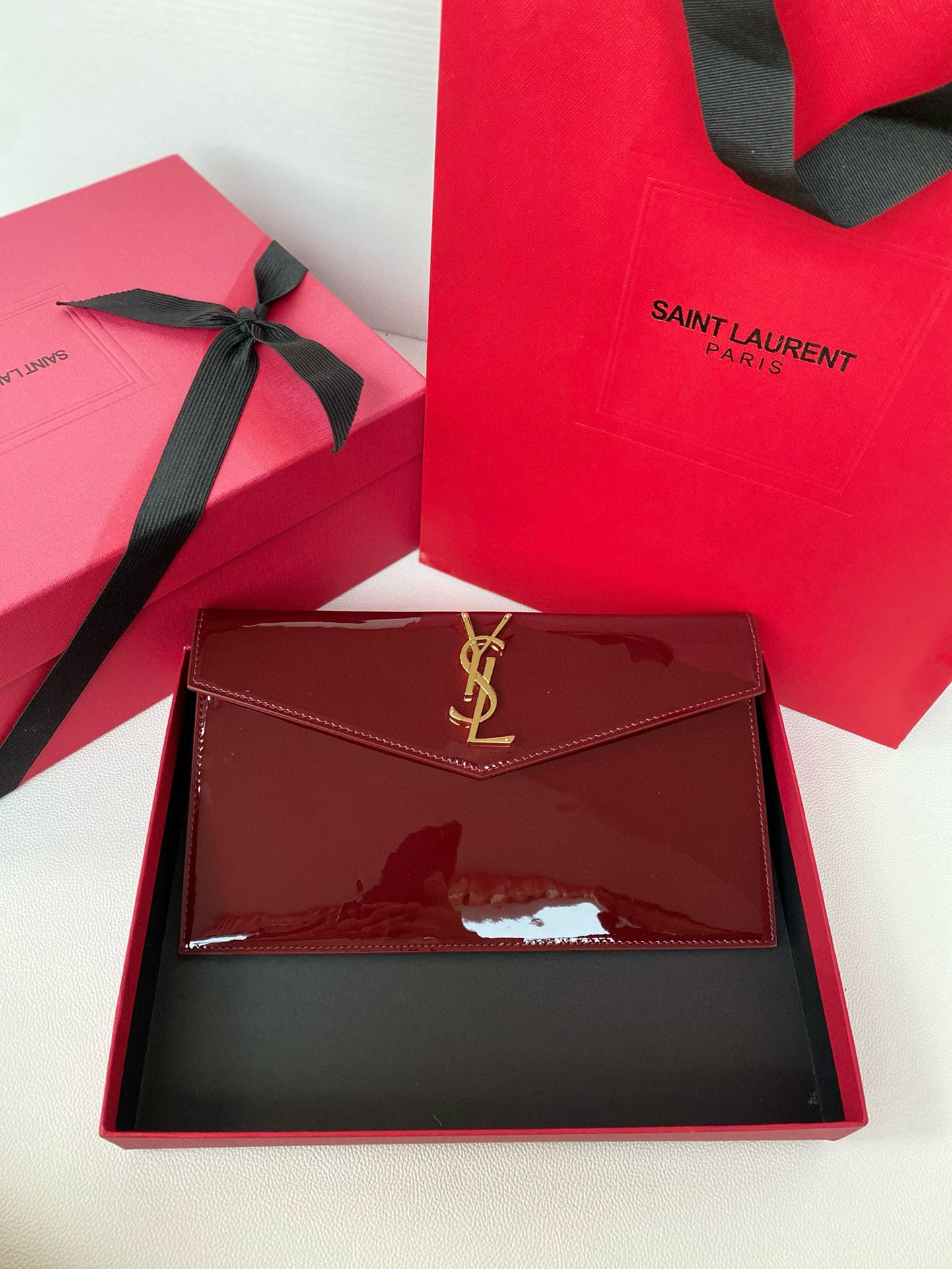 Yves Saint Laurent Uptown Pouch In Patent Leather