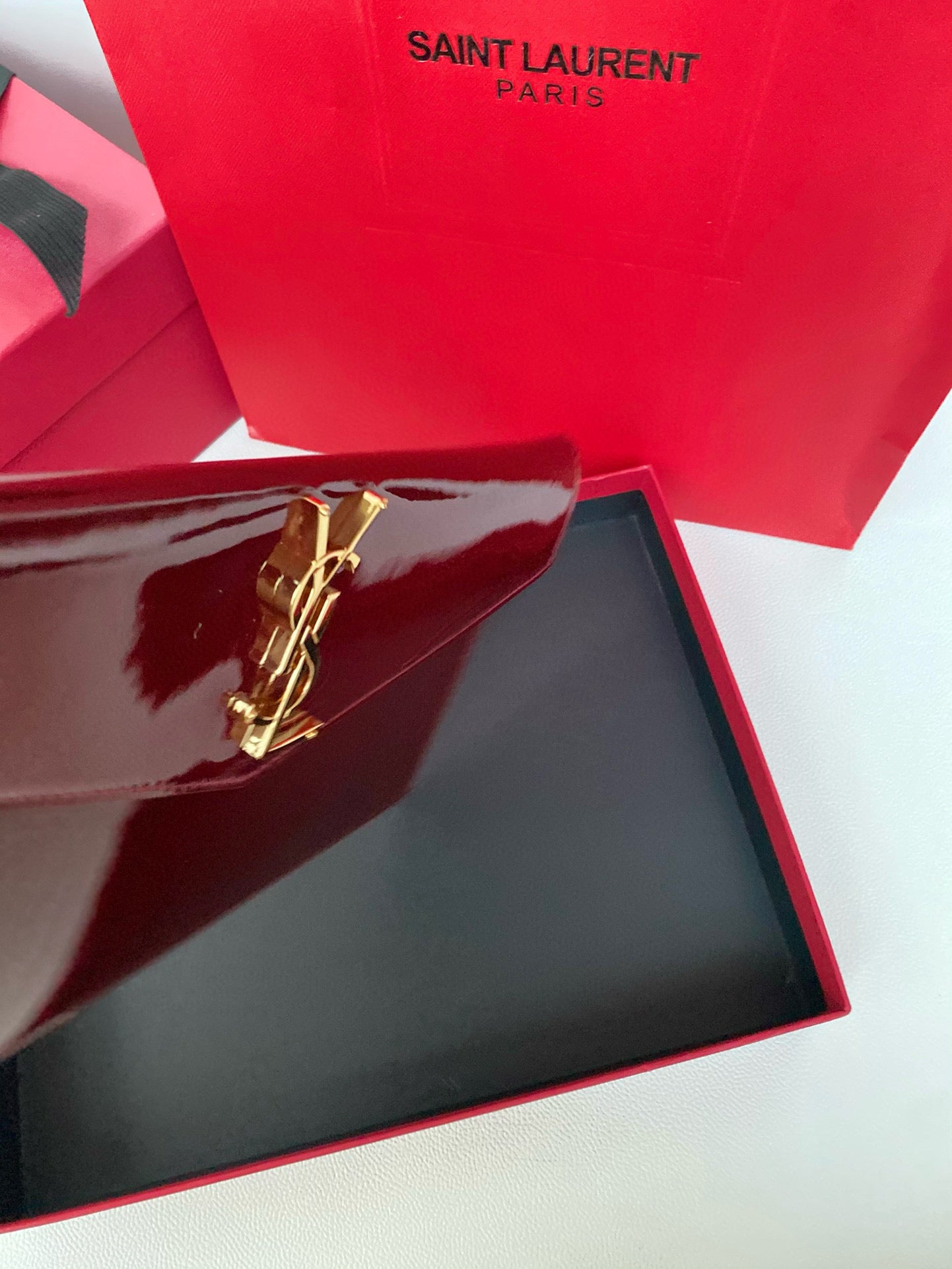 Yves Saint Laurent Uptown Pouch In Patent Leather