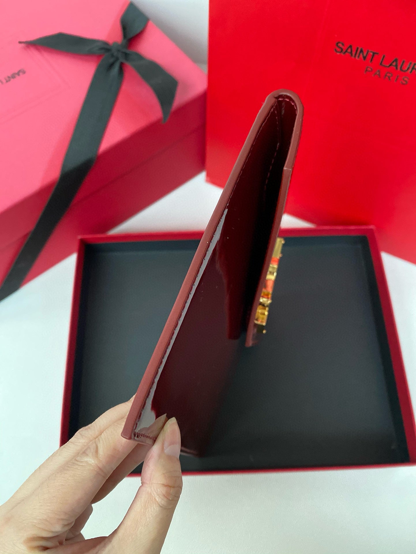 Yves Saint Laurent Uptown Pouch In Patent Leather