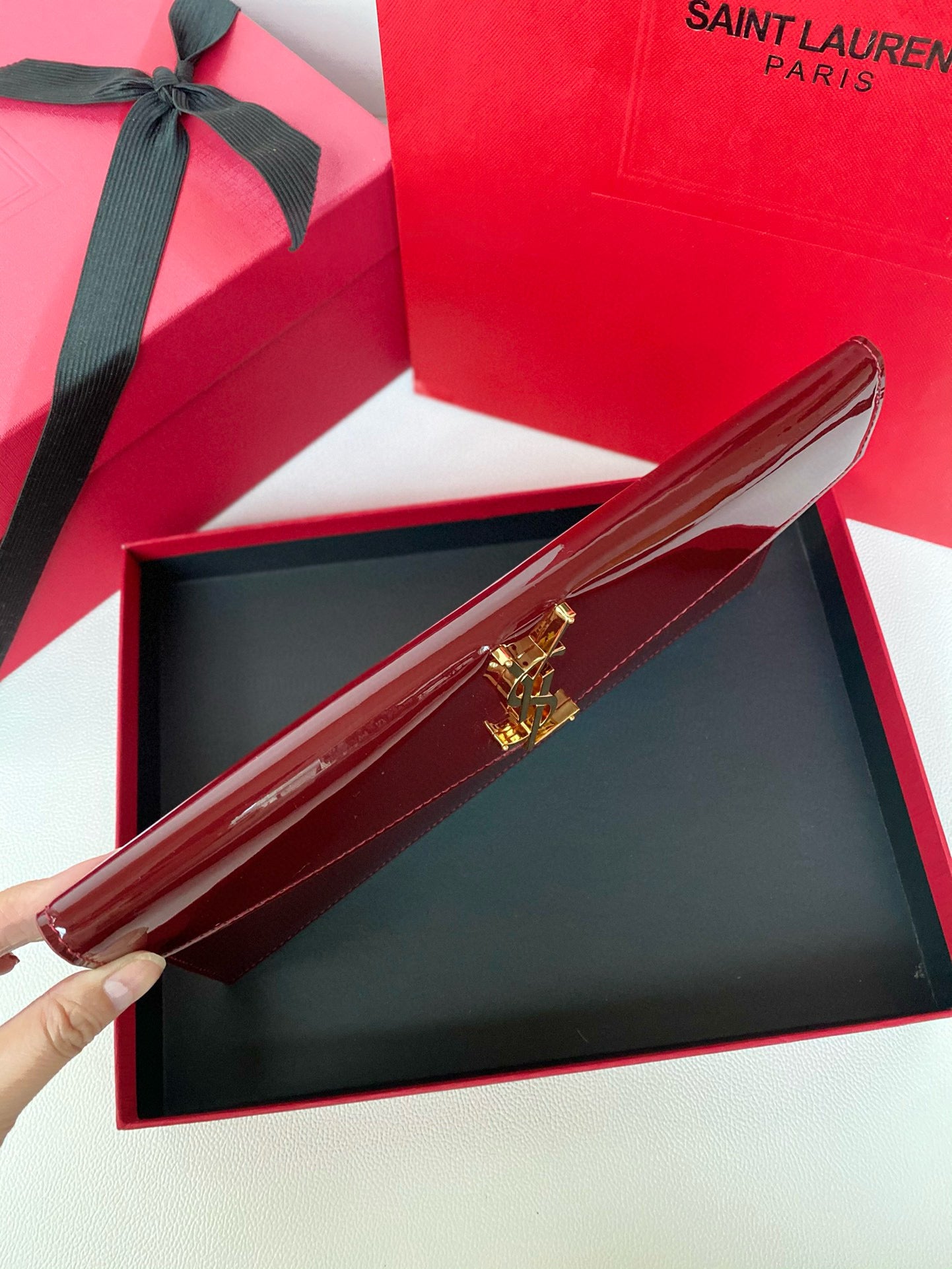 Yves Saint Laurent Uptown Pouch In Patent Leather